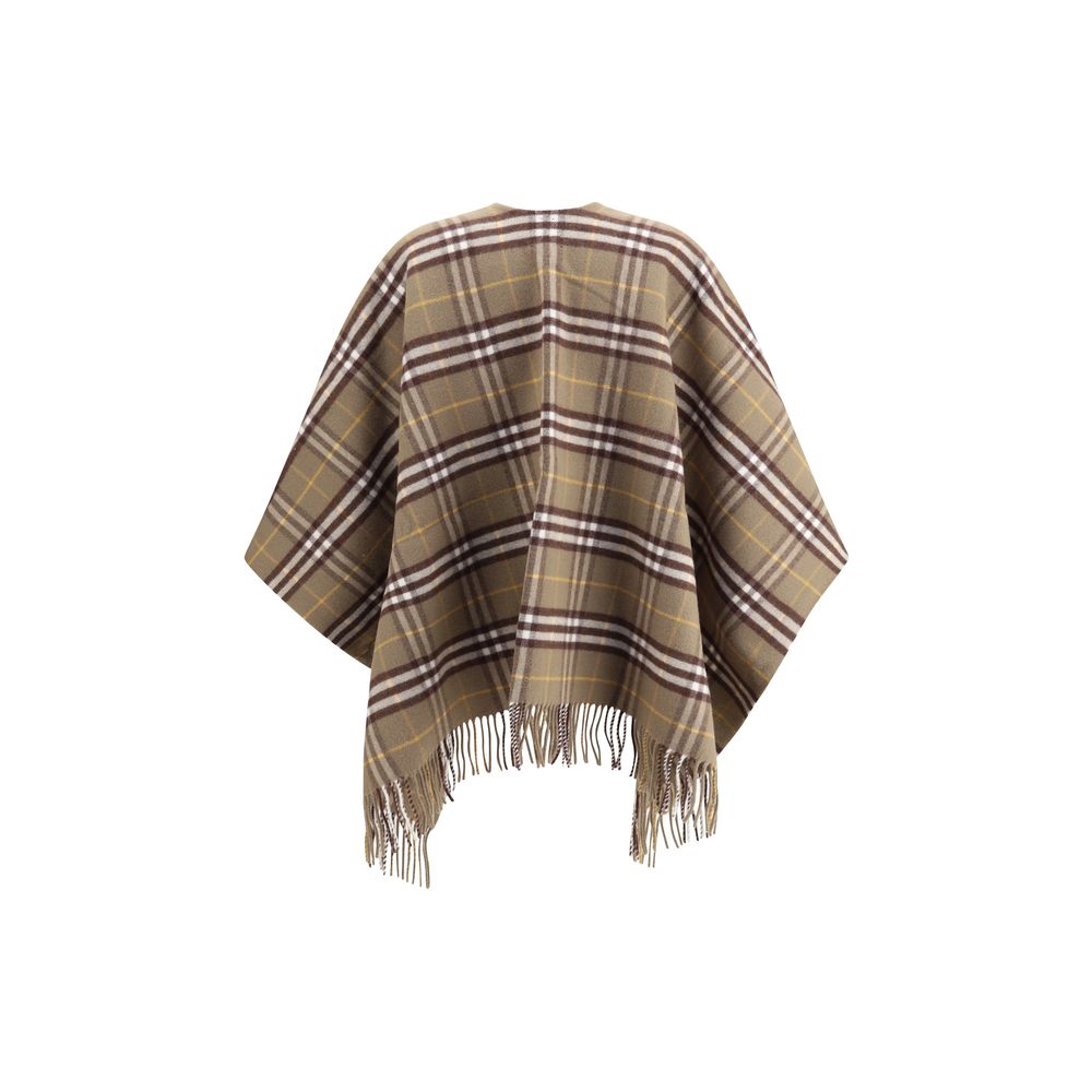 Brown Wool CoatThe Burberry Check Cape is crafted from a luxurious blend of wool and cashmere and features a double-faced finish featuring the iconic Burberry Check motif. The fabric, washed twice in local spring water, acquires an extraordinary softness