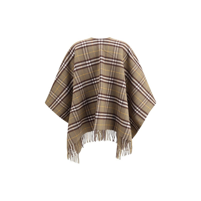 Brown Wool CoatThe Burberry Check Cape is crafted from a luxurious blend of wool and cashmere and features a double-faced finish featuring the iconic Burberry Check motif. The fabric, washed twice in local spring water, acquires an extraordinary softness