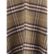 Brown Wool CoatThe Burberry Check Cape is crafted from a luxurious blend of wool and cashmere and features a double-faced finish featuring the iconic Burberry Check motif. The fabric, washed twice in local spring water, acquires an extraordinary softness
