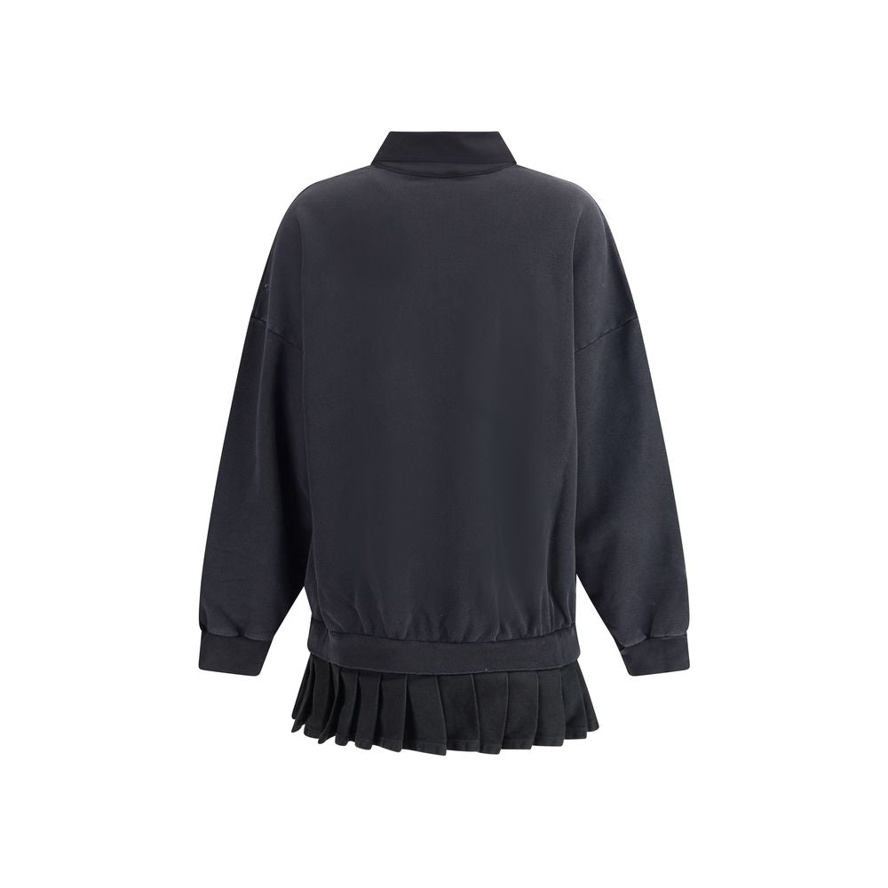 Black Cotton Casual DressBalenciaga’s swatshirt Dress blends casual style and iconic details in a worn-in design. Featuring a ribbed crew neck and cuffs, it features an embroidered logo on the front and a pleated skirt that adds movement and femininity to