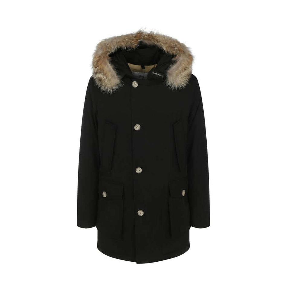 Black Cotton ParkaParka Arctic Jacket by Woolrich Woolen, front closure with invisible zip and cista buttons, two side patch pockets with flap for closure, two welt pockets on the front, patch with iconic brand signature applied on the neckline, elastic r