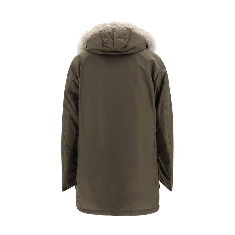 Green Cotton ParkaParka Arctic Jacket by Woolrich Woolen, front closure with invisible zip and cista buttons, two side patch pockets with flap for closure, two welt pockets on the front, patch with iconic brand signature applied on the neckline, elastic r