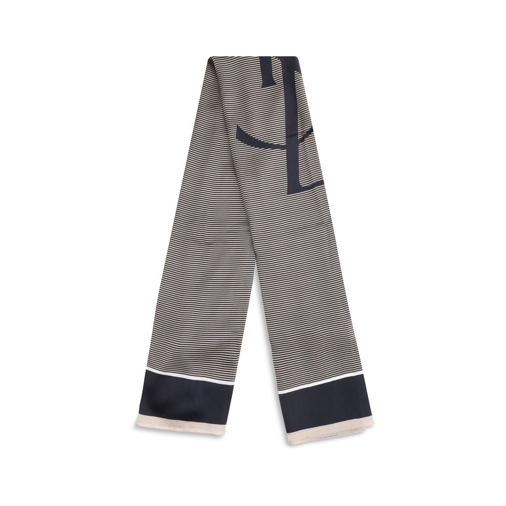 Cassandre striped StoleThe Saint Laurent Semi-Transparent Striped Stole is distinguished by the light elegance of the fabric and the essential design. The Cassandre signature stands out in the center, while the plain border and smooth trim complete the ac