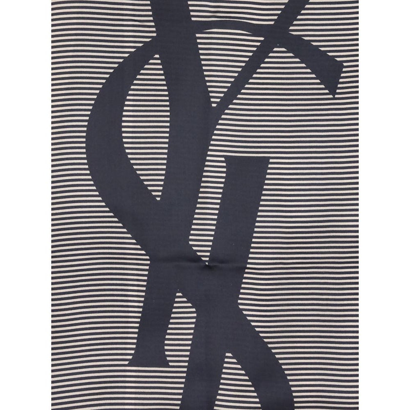 Cassandre striped StoleThe Saint Laurent Semi-Transparent Striped Stole is distinguished by the light elegance of the fabric and the essential design. The Cassandre signature stands out in the center, while the plain border and smooth trim complete the ac