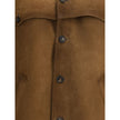 Brown Leather JacketPrada’s signature suede Jacket has an essential and refined design. Featuring a classic collar and a front button closure, it is completed by two welt pockets that enhance its clean lines. An iconic and versatile garment, perfect for a