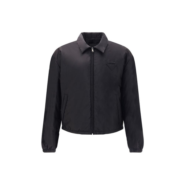 Re-Nylon bomber JacketThe Prada Re-Nylon Bomber Jacket combines sustainability with contemporary style. Featuring a classic collar and front zip, it features side welt pockets, elasticated cuffs and warm padding. The iconic triangle patch on the chest add