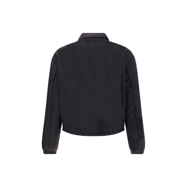 Re-Nylon bomber JacketThe Prada Re-Nylon Bomber Jacket combines sustainability with contemporary style. Featuring a classic collar and front zip, it features side welt pockets, elasticated cuffs and warm padding. The iconic triangle patch on the chest add