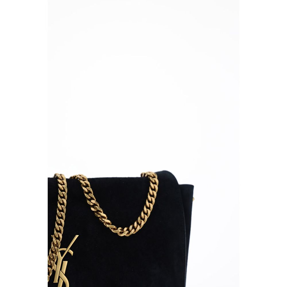 Black Calf Leather Bos Taurus Shoulder BagThe Kate Suede leather Shoulder Bag by Saint Laurent combines elegance and modernity. Featuring a front magnetic closure, it features an embossed plaque with the brand’s iconic monogram on the front. The sliding c