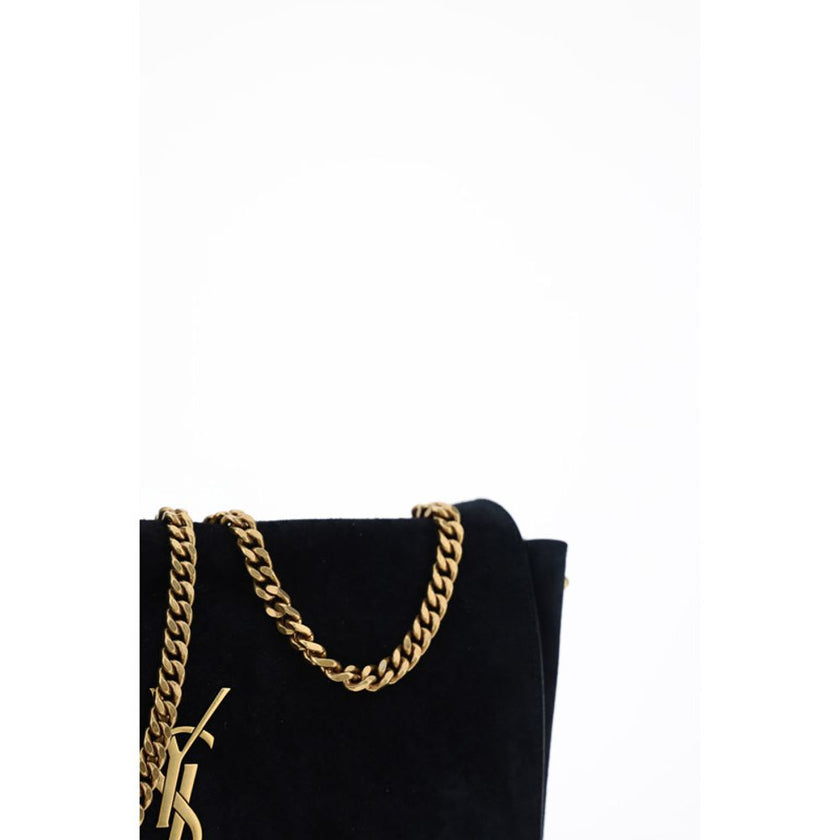 Black Calf Leather Bos Taurus Shoulder BagThe Kate Suede leather Shoulder Bag by Saint Laurent combines elegance and modernity. Featuring a front magnetic closure, it features an embossed plaque with the brand’s iconic monogram on the front. The sliding c