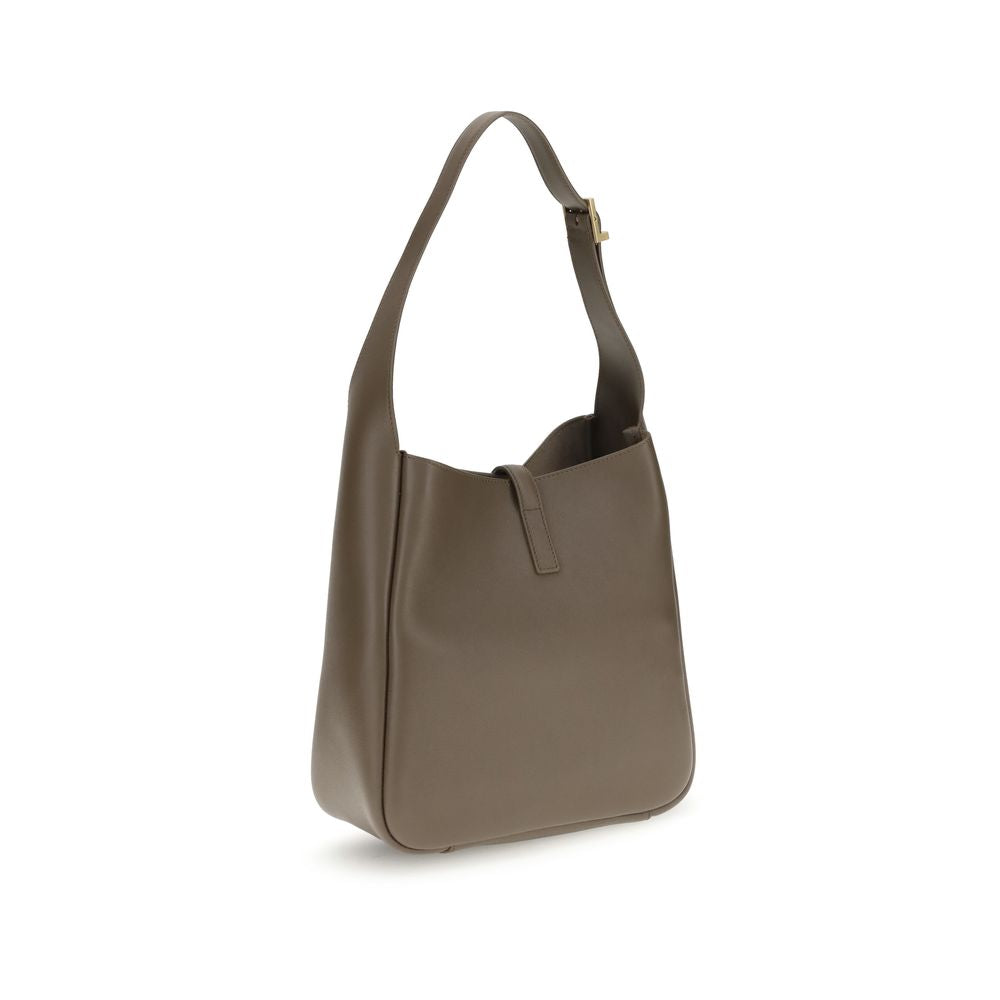 Brown Calf Leather Bos Taurus Shoulder BagSaint Laurent’s Cassandre Leather Shoulder Bag is the epitome of contemporary elegance. Featuring a refined hobo design, it features a supple grained leather silhouette and an adjustable shoulder strap with a logo