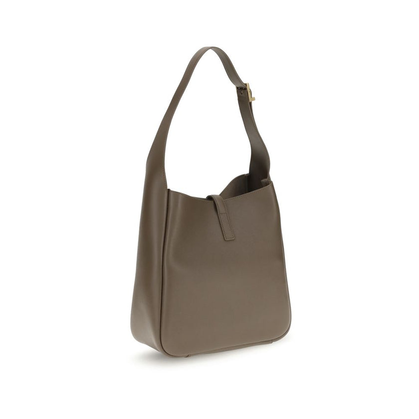 Brown Calf Leather Bos Taurus Shoulder BagSaint Laurent’s Cassandre Leather Shoulder Bag is the epitome of contemporary elegance. Featuring a refined hobo design, it features a supple grained leather silhouette and an adjustable shoulder strap with a logo