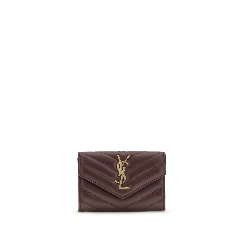 WalletThe Saint Laurent Cassandre leather Wallet combines elegance and functionality with a quilted matelassé design and front flap with magnetic closure. Embellished with the iconic three-dimensional metal YSL logo, it features a coin compartment, card s