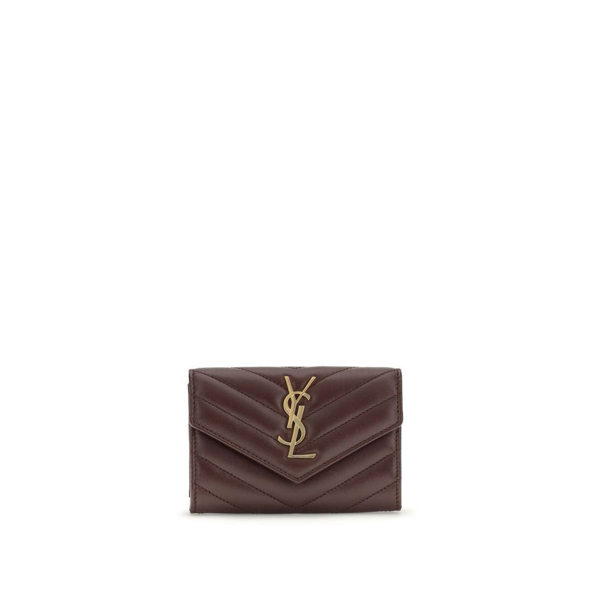 WalletThe Saint Laurent Cassandre leather Wallet combines elegance and functionality with a quilted matelassé design and front flap with magnetic closure. Embellished with the iconic three-dimensional metal YSL logo, it features a coin compartment, card s