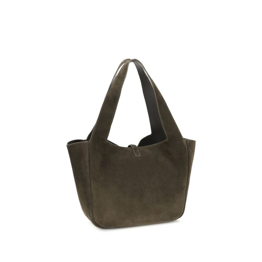 Green Calf Leather Bos Taurus Shoulder BagThe Le 5 à 7 Bea Tote Bag by Saint Laurent, made of suede leather, is an elegant versatile accessory with a refined design. The closure features a strap with a Cassandre logo plaque and a snap button, giving it a