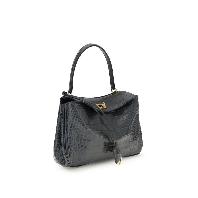 Black Calf Leather Bos Taurus Shoulder BagThe Rodeo Shoulder Bag in crocodile-print leather by Balenciaga features a top handle for a comfortable and elegant grip. The front closure is equipped with a flap and turn lock, adding a distinctive and functiona