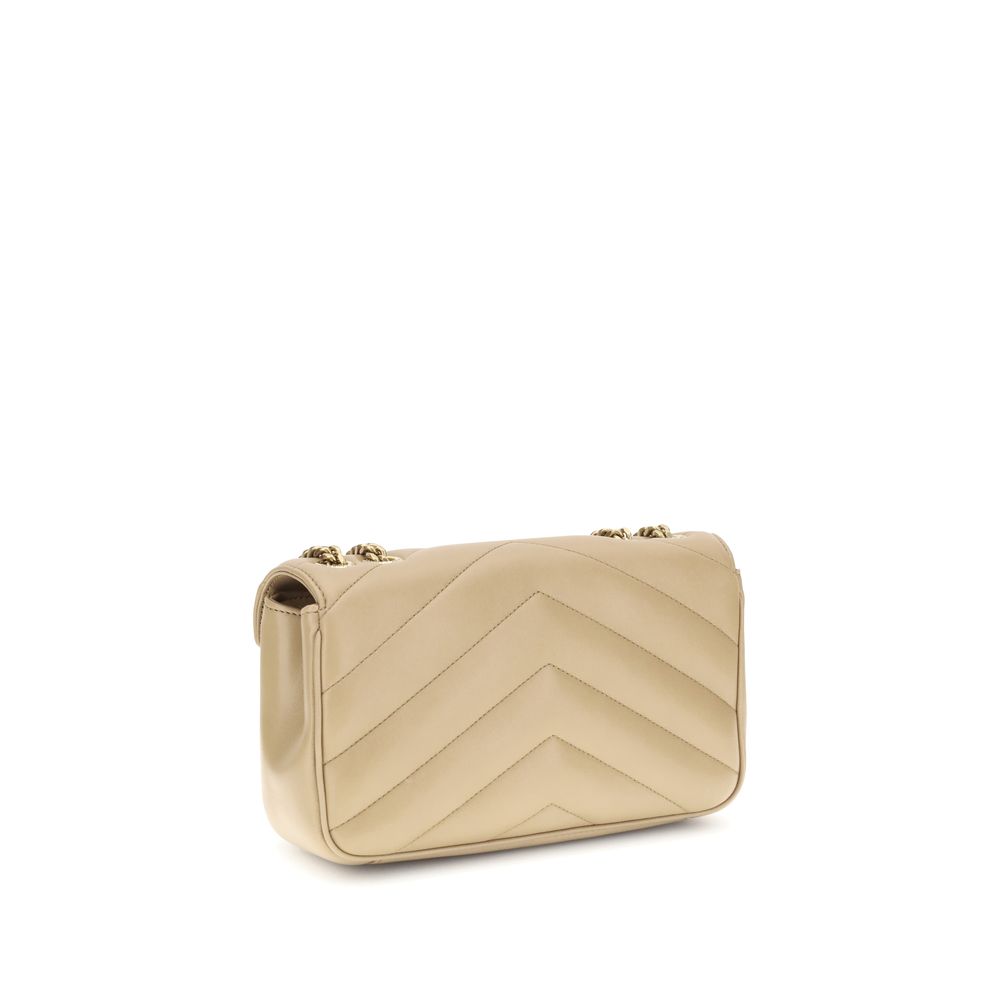 Beige Lamb Ovis Aries Aries Shoulder BagThe LouLou Shoulder Bag by Saint Laurent is an icon of timeless elegance. Crafted with the unmistakable quilted design, it features a front closure with magnetic flap embellished with the brass logo applied on the f