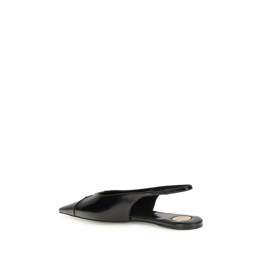 Black Calf Leather Bos Taurus Ballet FlatsSaint Laurent’s Babylon Ballerinas reinterpret classic elegance with a distinctive modern twist. Open at the back, they feature a sleek silhouette thanks to an elongated cut-out toe, embellished with the iconic CA