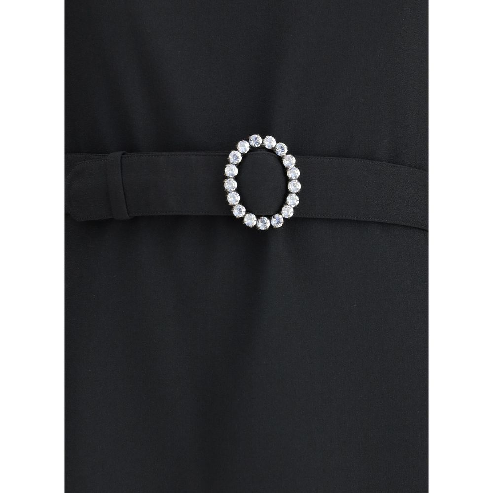 Black Viscose Cocktail DressSaint Laurent’s mini Dress is an elegant and structured design perfect for special occasions. Made with long sleeves and a round neckline, it features a refined button closure at the back of the neck, as well as a hidden hook-a