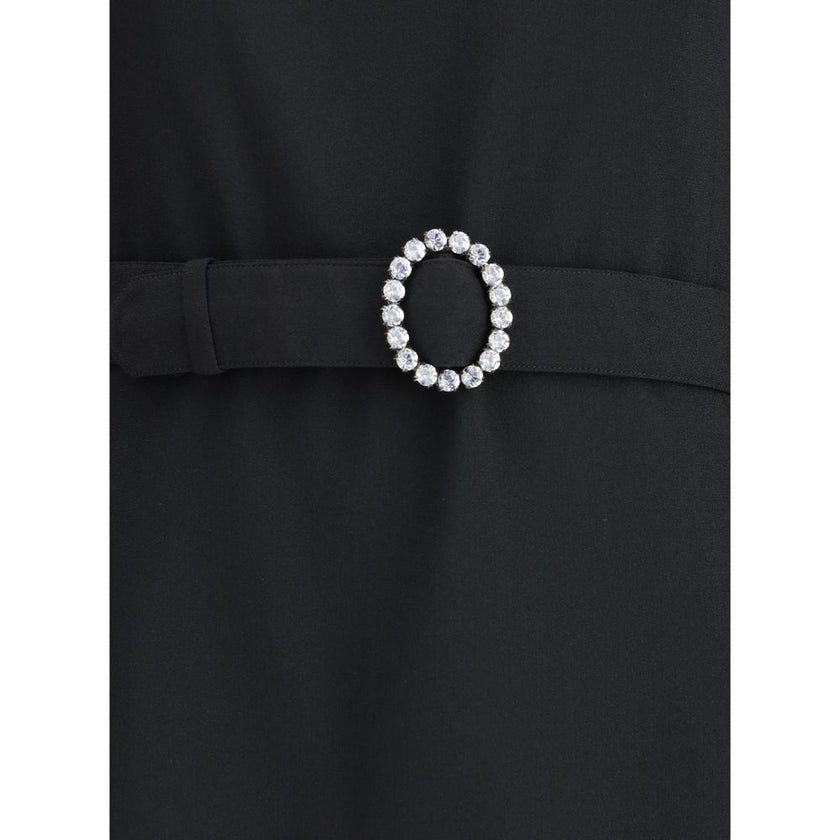 Black Viscose Cocktail DressSaint Laurent’s mini Dress is an elegant and structured design perfect for special occasions. Made with long sleeves and a round neckline, it features a refined button closure at the back of the neck, as well as a hidden hook-a
