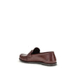 Brown Calf Leather Bos Taurus Slip-On LoafersSaint Laurent’s Laurent Loafers are a sleek, modern interpretation of the classic loafer. Featuring a hand-sewn square moc toe, they combine craftsmanship and contemporary design. The gold metal Cassandre decor