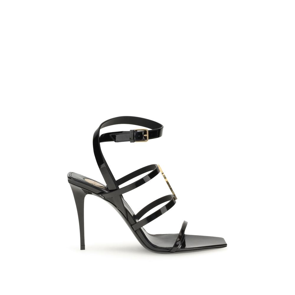 Black Calf Leather Bos Taurus Stiletto Heel SandalsSaint Laurent’s Cassandra Sandals embody the brand’s bold elegance. Crafted from patent leather, they feature a multi-strap design with a square toe and lacquered stiletto heel that slims the figure with