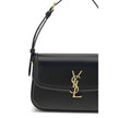 Black Calf Leather Bos Taurus Shoulder BagThe medium Solferino Shoulder Bag by Saint Laurent is an elegant reinterpretation of the iconic model, crafted in fine Box leather. Characterized by slightly rounded lines, it is distinguished by a sliding closure