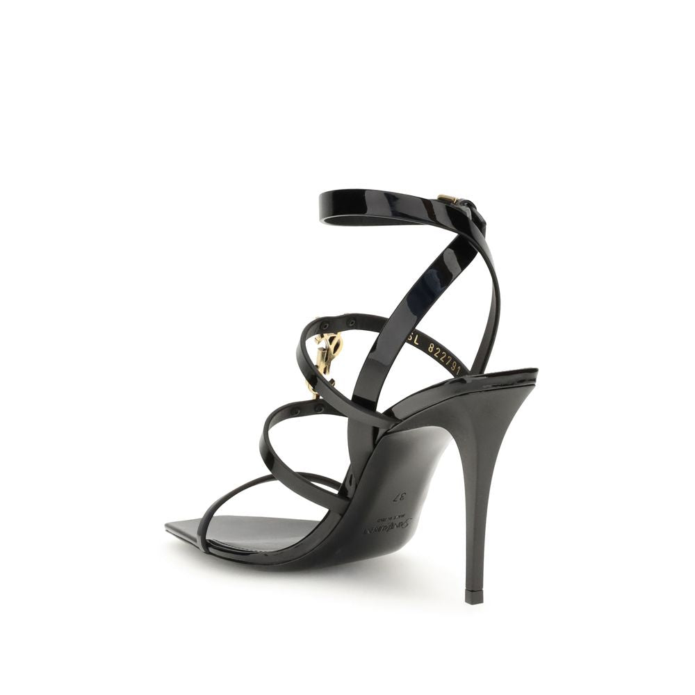 Black Calf Leather Bos Taurus Stiletto Heel SandalsSaint Laurent’s Cassandra Sandals embody the brand’s bold elegance. Crafted from patent leather, they feature a multi-strap design with a square toe and lacquered stiletto heel that slims the figure with