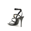 Black Calf Leather Bos Taurus Stiletto Heel SandalsSaint Laurent’s Cassandra Sandals embody the brand’s bold elegance. Crafted from patent leather, they feature a multi-strap design with a square toe and lacquered stiletto heel that slims the figure with
