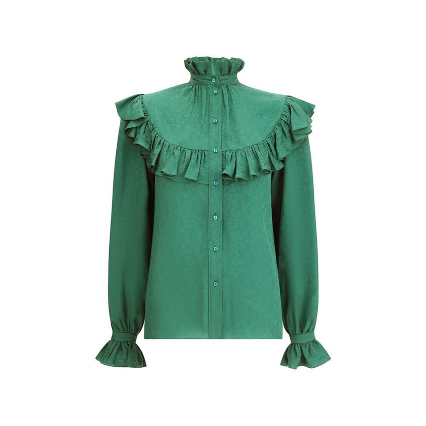 Green Silk BlouseSaint Laurent’s silk Blouse is an elegant garment with a romantic flair, enhanced by a delicate tone-on-tone paisley pattern. Featuring a mandarin collar and ruffles at the neck, chest and along the sleeves, it has a front button closure