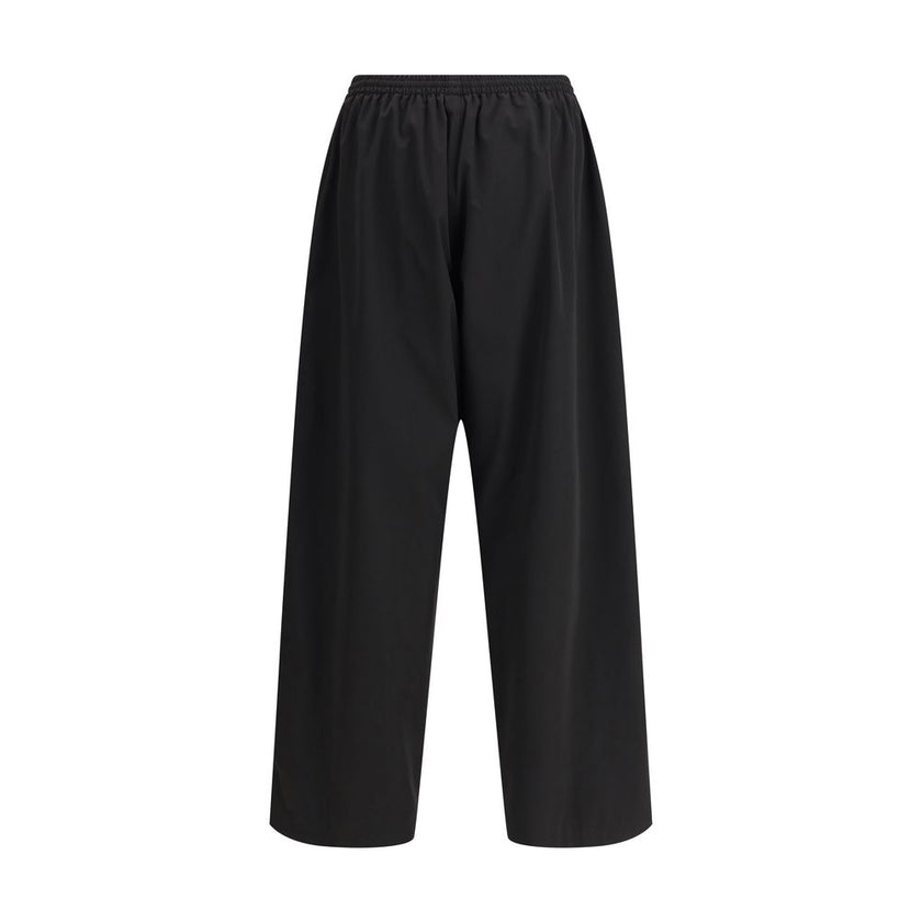 Black Polyester Casual PantsThe Sweatpants by Balenciaga combine comfort and minimalist style. Featuring an elasticized waistband and a straight, wide-leg silhouette, they offer a relaxed, contemporary fit. A straight hem completes the essential design, p