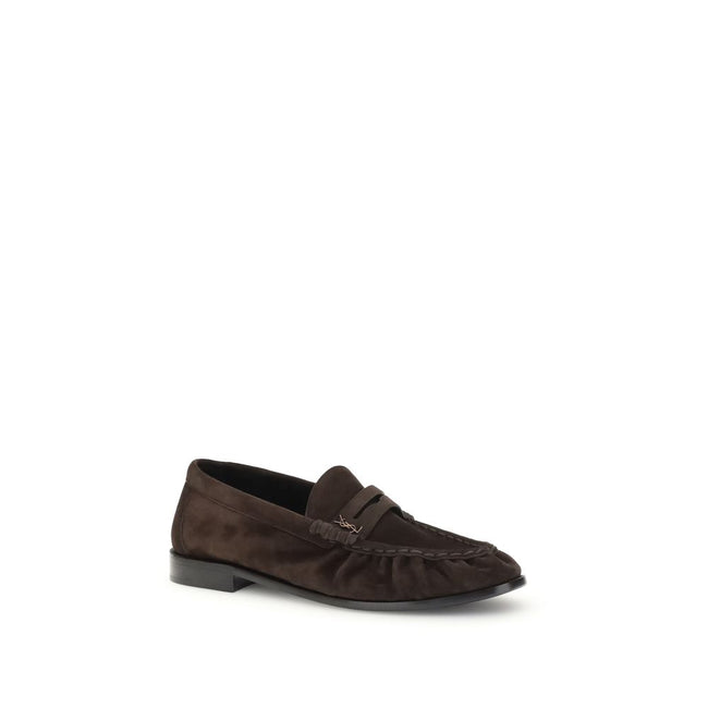 Brown Calf Leather Bos Taurus Slip-On LoafersSaint Laurent’s Cassandre Loafers combine comfort and sophistication in an elegant design. Made of soft leather, they are embellished with the gold metal Cassandre decoration and hand-stitched moc toe, a sign o