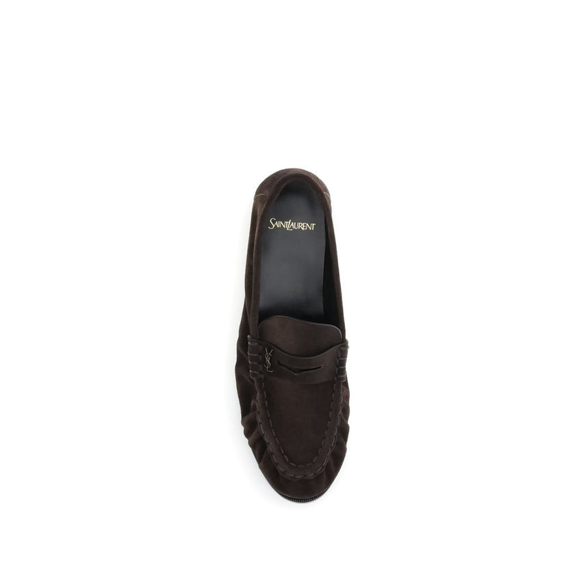 Brown Calf Leather Bos Taurus Slip-On LoafersSaint Laurent’s Cassandre Loafers combine comfort and sophistication in an elegant design. Made of soft leather, they are embellished with the gold metal Cassandre decoration and hand-stitched moc toe, a sign o