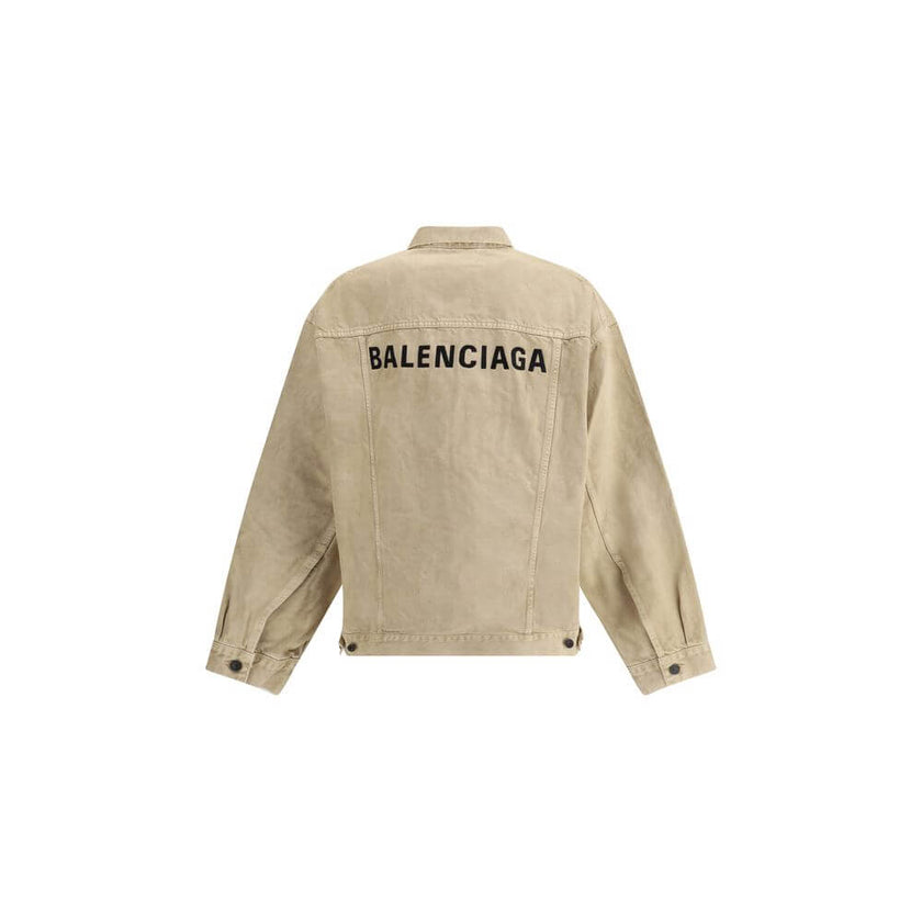 Beige Cotton Denim JacketThe oversized Denim Jacket by Balenciaga features a 7-button closure, front flap pockets and side slit pockets. Adjustable cuffs and waist with Balenciaga engraved metal buttons. The embroidered logo on the back elegantly signs th