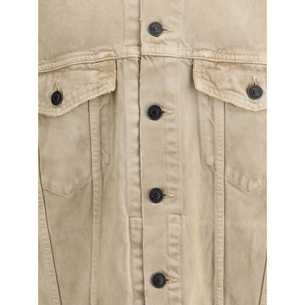Beige Cotton Denim JacketThe oversized Denim Jacket by Balenciaga features a 7-button closure, front flap pockets and side slit pockets. Adjustable cuffs and waist with Balenciaga engraved metal buttons. The embroidered logo on the back elegantly signs th