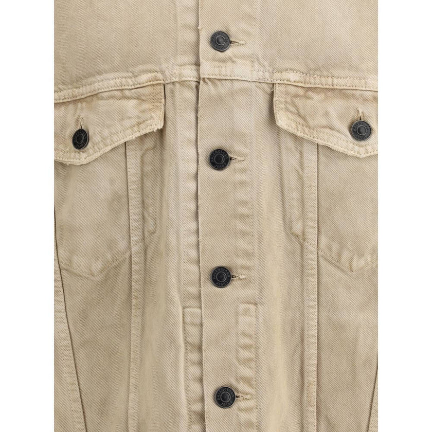 Beige Cotton Denim JacketThe oversized Denim Jacket by Balenciaga features a 7-button closure, front flap pockets and side slit pockets. Adjustable cuffs and waist with Balenciaga engraved metal buttons. The embroidered logo on the back elegantly signs th