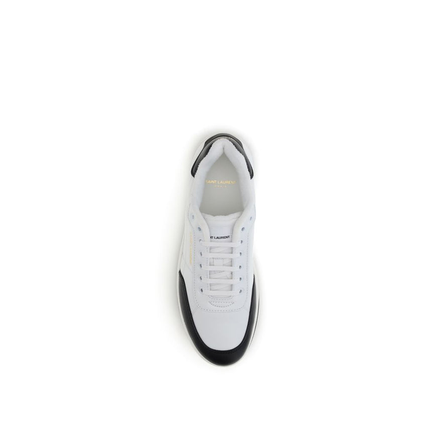 White Calf Leather Bos Taurus Low Top SneakersSaint Laurent’s SL61 Sneakers combine clean styling with refined details. Featuring a flat sole and lace-up closure, they feature logos on the side and heel, while the suede panel adds a touch of texture and s