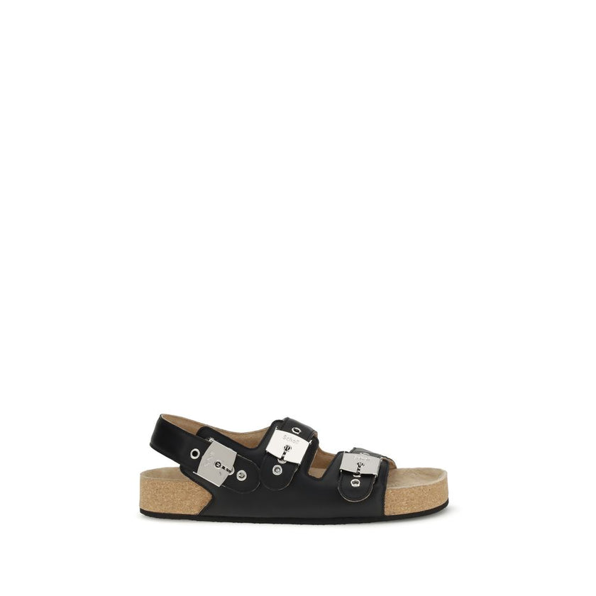 Black Calf Leather Bos Taurus Flat SandalsBalenciaga’s Scholl Flat Sandals, made of calfskin leather, are the result of a collaboration between the two brands and blend comfort and contemporary style. They feature three adjustable straps with metal buckle