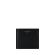Black Calf Leather Bos Taurus WalletCalfskin Wallet by Saint Laurent, billfold design, interior card slots, bill compartment, iconic brand signature press-stamped on front, grained leather design. Season: AW25 Dimension: 11.5×11.5 Composition: 100% Calf L