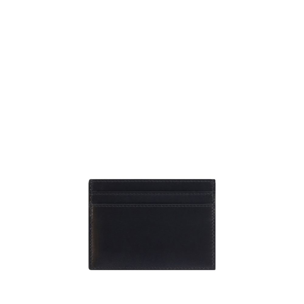 Black Calf Leather Bos Taurus WalletCalfskin Card Holder by Saint Laurent, card slots on both sides, embossed brass logo on front. Season: AW25 Dimension: 12×12 Composition: 100% Calf Leather Bos Taurus MADE IN ITALYBlack Calf Leather Bos Taurus Wallet${t