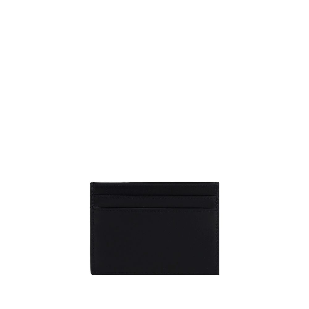 Black Calf Leather Bos Taurus WalletCalfskin Card Holder by Saint Laurent, card slots on front and back, logo plaque on front. Season: AW25 Dimension: 11×11 Composition: 100% Calf Leather Bos Taurus MADE IN ITALYBlack Calf Leather Bos Taurus Wallet${tagsS