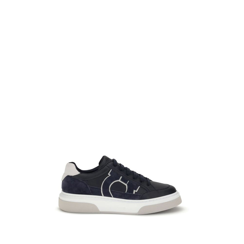 Blue Calf Leather Bos Taurus Low Top SneakersFerragamo’s Gancini leather Sneakers combine retro inspiration with contemporary details. Crafted from leather with suede inserts, they recall classic ’90s basketball shoes. The side inlay with a Gancini silhou
