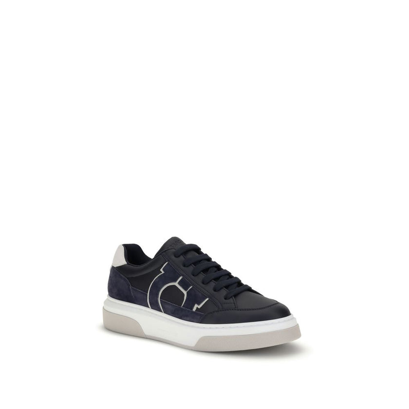 Blue Calf Leather Bos Taurus Low Top SneakersFerragamo’s Gancini leather Sneakers combine retro inspiration with contemporary details. Crafted from leather with suede inserts, they recall classic ’90s basketball shoes. The side inlay with a Gancini silhou
