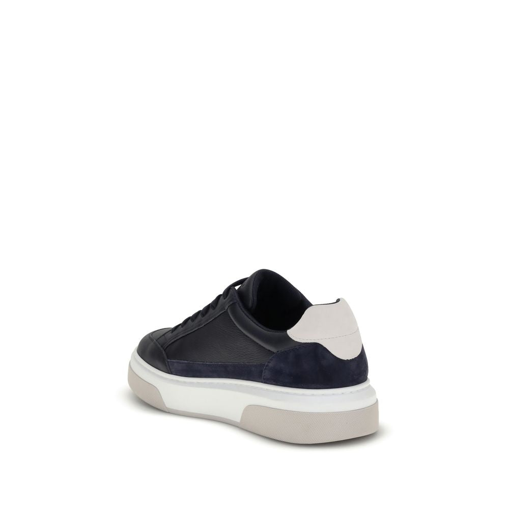 Blue Calf Leather Bos Taurus Low Top SneakersFerragamo’s Gancini leather Sneakers combine retro inspiration with contemporary details. Crafted from leather with suede inserts, they recall classic ’90s basketball shoes. The side inlay with a Gancini silhou