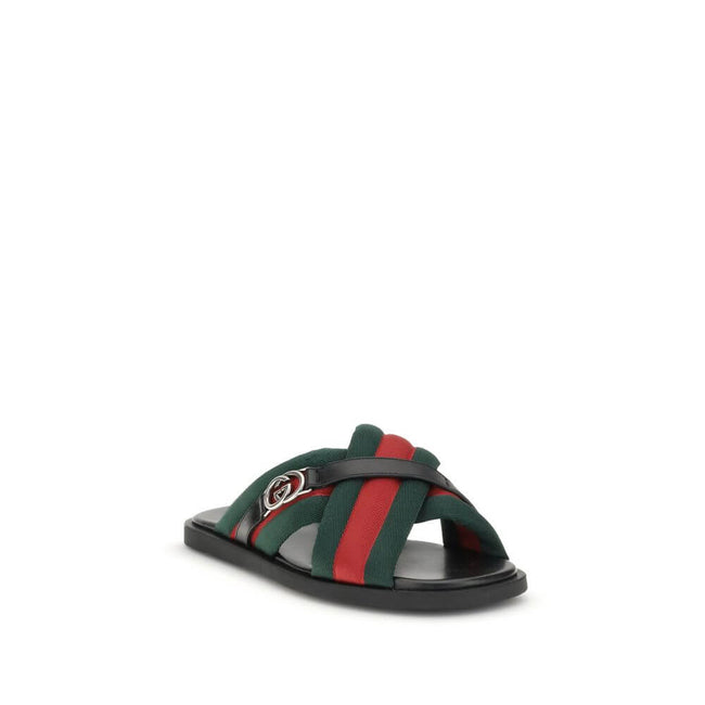 Black Polyamide Flat SandalsGucci’s men’s Web Sandals with Interlocking GG are crafted from the iconic green and red Web fabric, evoking the House’s equestrian roots. The elegant design is enhanced by the silver-tone Interlocking GG logo, adding a touch o