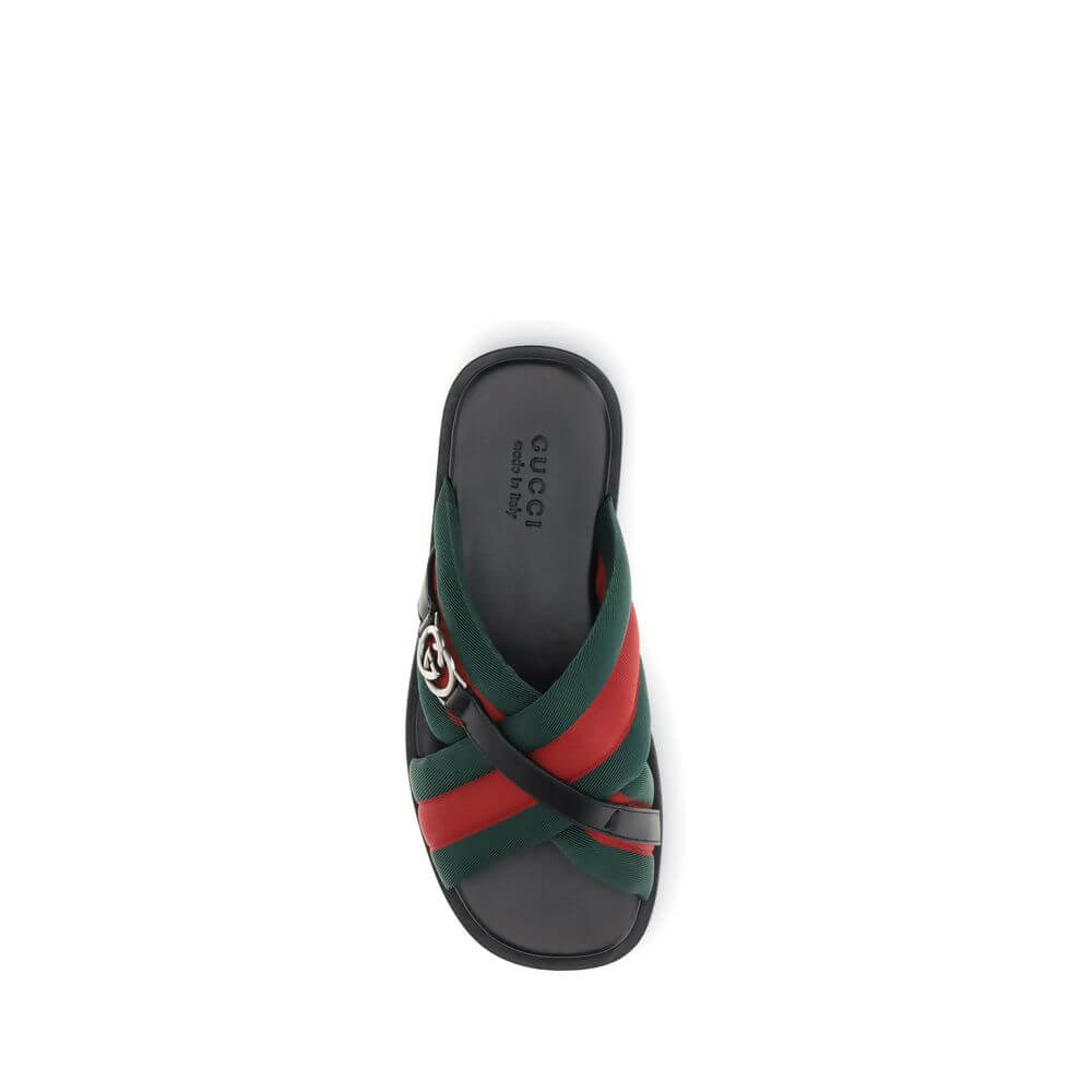 Black Polyamide Flat SandalsGucci’s men’s Web Sandals with Interlocking GG are crafted from the iconic green and red Web fabric, evoking the House’s equestrian roots. The elegant design is enhanced by the silver-tone Interlocking GG logo, adding a touch o
