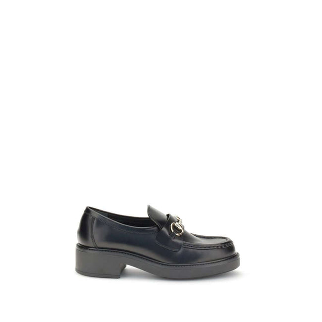 Black Calf Leather Bos Taurus Slip-On LoafersGucci’s Horsebit Loafers are a timeless classic reimagined with a contemporary edge. Featuring a round toe and a sturdy block heel, they feature the House’s iconic metal horsebit detail on the front. A versatil