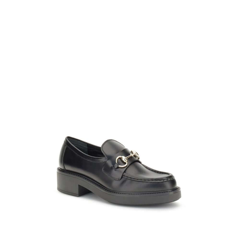 Black Calf Leather Bos Taurus Slip-On LoafersGucci’s Horsebit Loafers are a timeless classic reimagined with a contemporary edge. Featuring a round toe and a sturdy block heel, they feature the House’s iconic metal horsebit detail on the front. A versatil