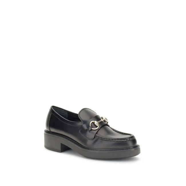 Black Calf Leather Bos Taurus Slip-On LoafersGucci’s Horsebit Loafers are a timeless classic reimagined with a contemporary edge. Featuring a round toe and a sturdy block heel, they feature the House’s iconic metal horsebit detail on the front. A versatil