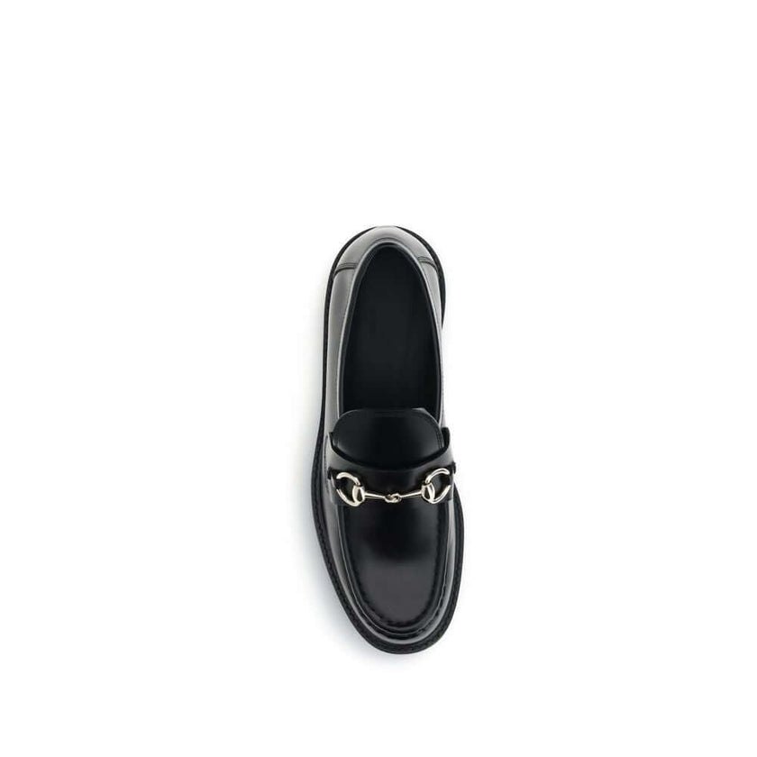 Black Calf Leather Bos Taurus Slip-On LoafersGucci’s Horsebit Loafers are a timeless classic reimagined with a contemporary edge. Featuring a round toe and a sturdy block heel, they feature the House’s iconic metal horsebit detail on the front. A versatil