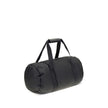 Black Nylon Luggage And TravelThe Moncler duffle Travel Bag combines functionality and style in a sporty, elegant design. Crafted from nylon with DIST-certified down padding, it features leather-tab handles with snap buttons, as well as an adjustable and
